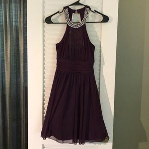 Cocktail dress with beautiful beaded neckline.